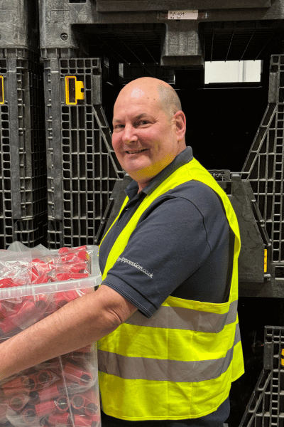 Man in high-vis with a box